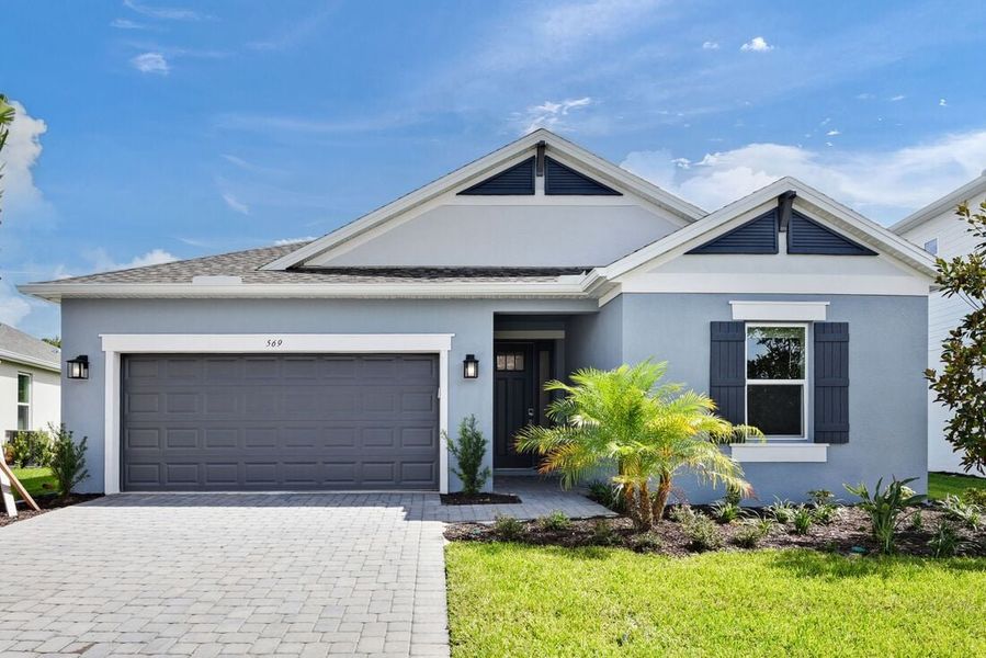 Representative exterior photo of a completed home built from the Grenada by Taylor Morrison in Ardisia Park, New Smyrna Beach, FL (Image 1).