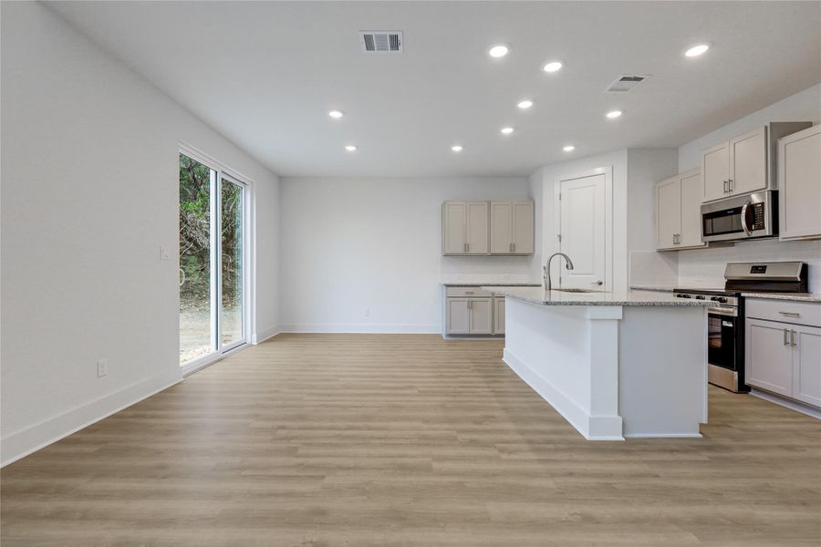 Dining space opens to the backyard for easy entertianing.