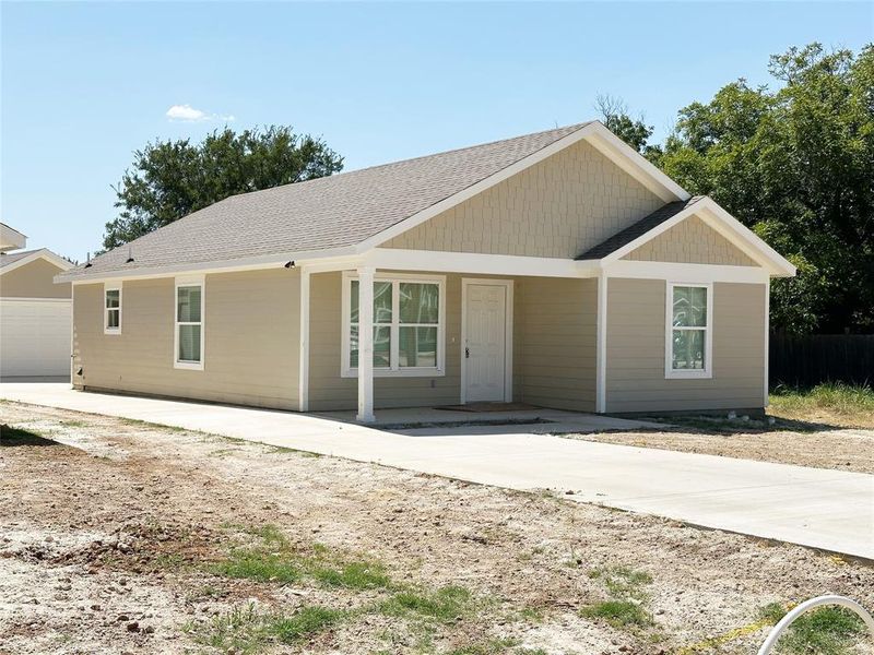 Front exterior of a new home in , Mineral Wells, TX, highlighting curb appeal (Image 13). Front exterior of a new home in , Mineral Wells, TX, highlighting curb appeal (Image 13).