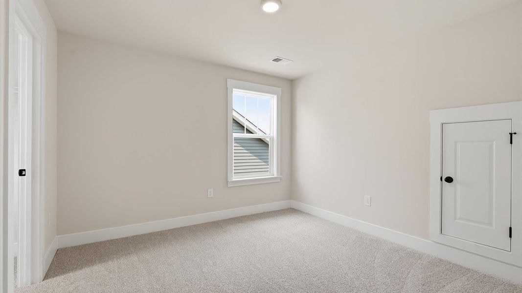 Superior comfort in this light-filled bedroom with plush carpeting and thoughtfully placed large windows Superior comfort in this light-filled bedroom with plush carpeting and thoughtfully placed large windows