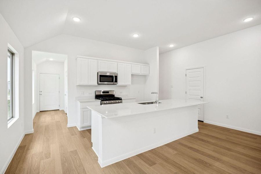 Kitchen in the Spruce home plan by Trophy Signature Homes - REPRESENTATIVE PHOTO