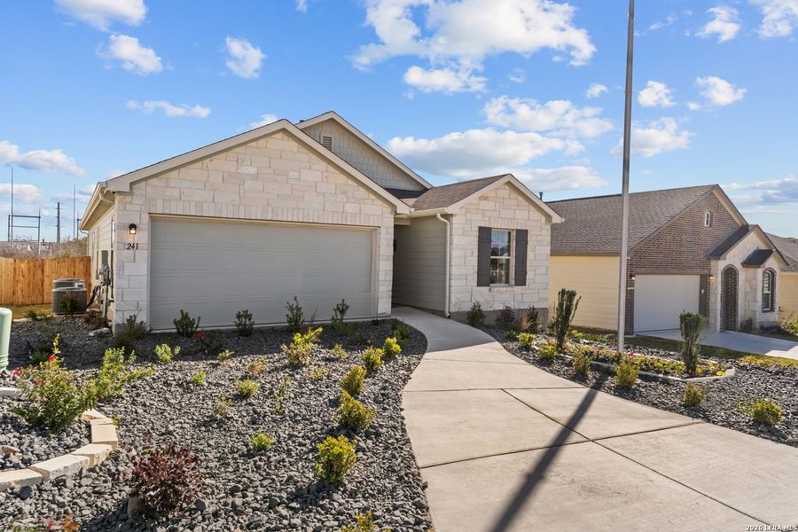 Front exterior of a new home in Hunters Ranch, San Antonio, TX, highlighting curb appeal (Image 26).