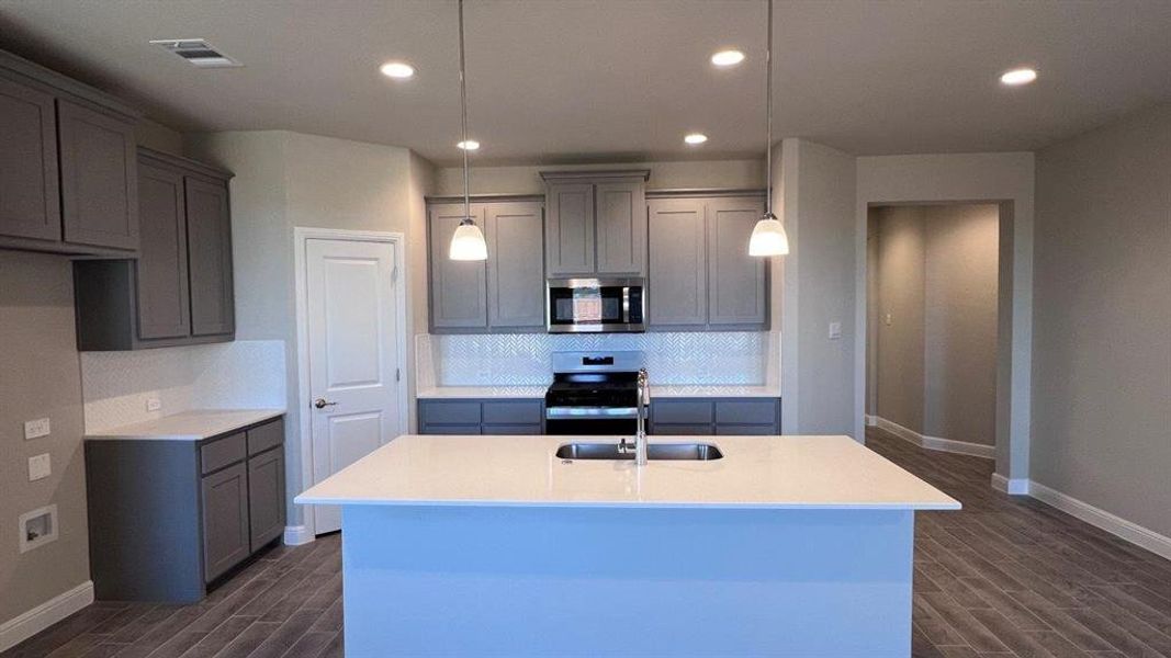 Kitchen-All Home and community information, including pricing, included features, terms, availability and amenities, are subject to change at any time without notice or obligation. All Drawings, pictures, photographs, video, square footages, floor plans, elevations, features, colors and sizes are approximate for illustration purposes only and will vary from the homes as built.