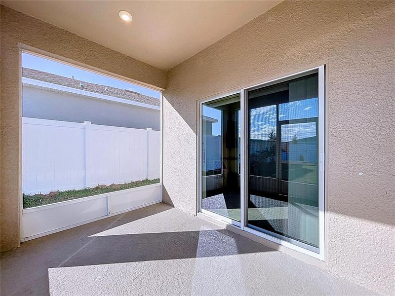 Exterior details and patio area of a home in Covered Bridge at Liberty Bluff, Haines City (Image 4).