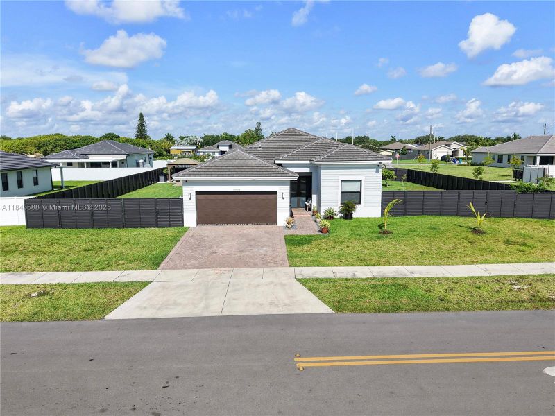 Front exterior of a new home in , Homestead, FL, highlighting curb appeal (Image 20).