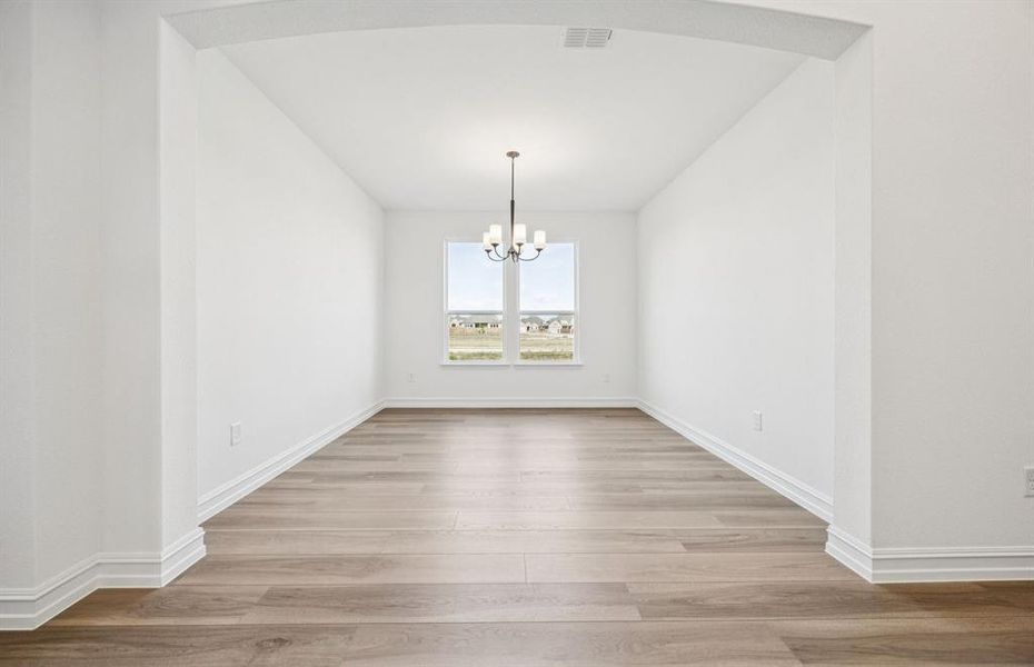 Formal dining room with large windows Formal dining room with large windows