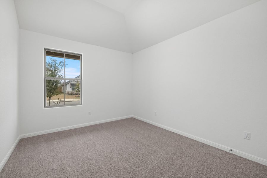 Bedroom in the Quartz home plan by Trophy Signature Homes – REPRESENTATIVE PHOTO