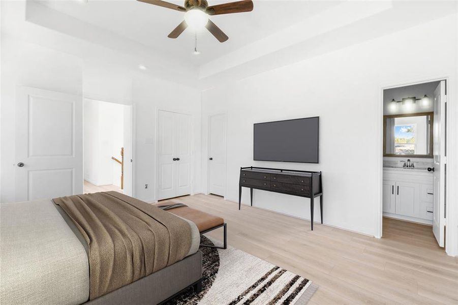 Another view of the master bedroom reveals the doorway to the ensuite on the right, with the closets and hallway entrance conveniently located on the left. (Photo may be enhanced and may include virtual staging)