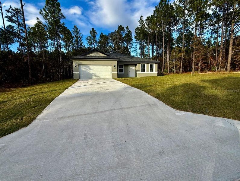 Front exterior of a new home in , Citrus Springs, FL, highlighting curb appeal (Image 29).