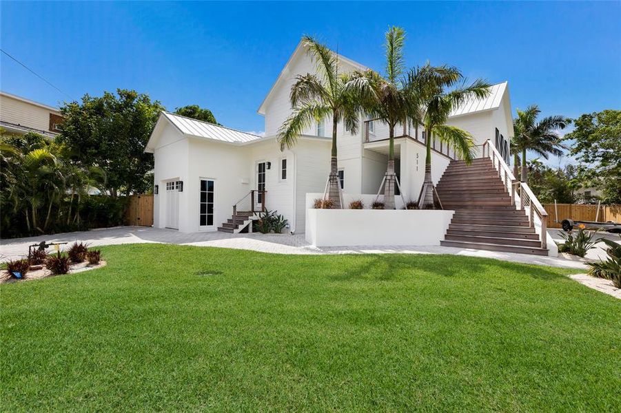 Front exterior of a new home in , Bradenton Beach, FL, highlighting curb appeal (Image 21).