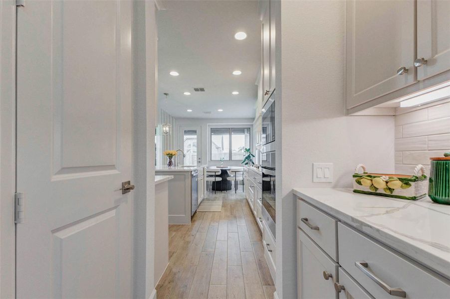 Butler pantry with sleek cabinetry, stainless steel appliances, and a bright, airy atmosphere. Walk in pantry with plenty of storage space. Butler pantry with sleek cabinetry, stainless steel appliances, and a bright, airy atmosphere. Walk in pantry with plenty of storage space.