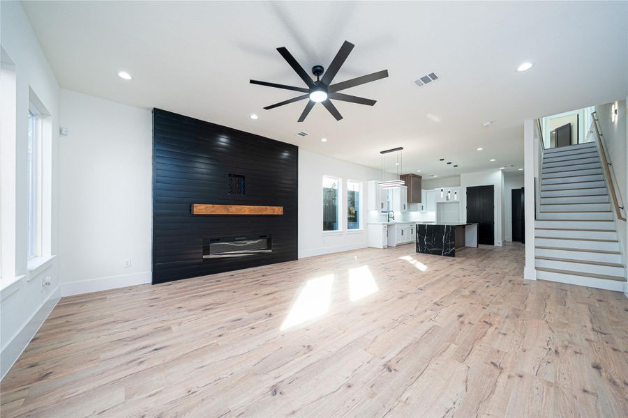 This spacious living room showcases energy-efficient windows that fill the space with natural light, along with a charming fireplace that sets the perfect tone for cozy, warm nights. It’s an inviting retreat designed for relaxation and comfort. This spacious living room showcases energy-efficient windows that fill the space with natural light, along with a charming fireplace that sets the perfect tone for cozy, warm nights. It’s an inviting retreat designed for relaxation and comfort.