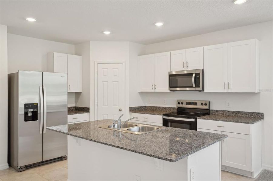 Furnished interior view inside a new home in Lake Deer Estates - Signature Series, Poinciana (Image 6). Furnished interior view inside a new home in Lake Deer Estates - Signature Series, Poinciana (Image 6).