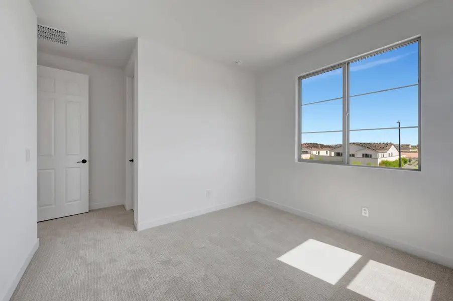 Spacious, unfurnished interior of a new home in Soleo, San Tan Valley (Image 42).