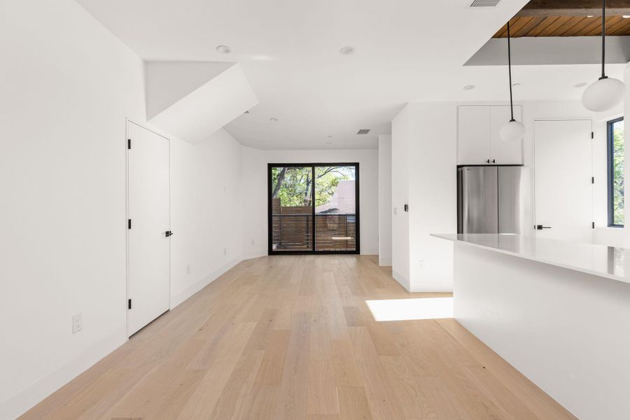 Unfurnished living room with light wood-style flooring