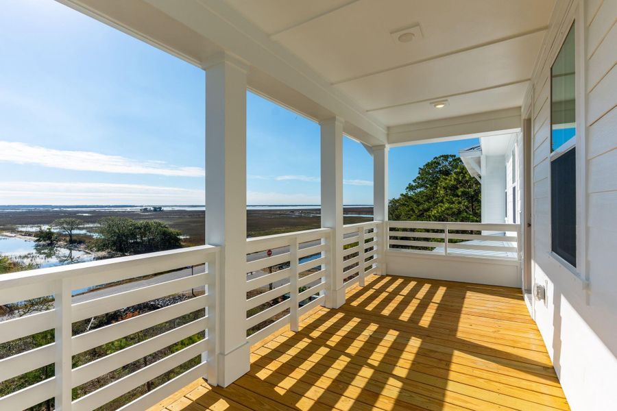 Exterior details and patio area of a home in Overlook at Copahee Sound, Awendaw (Image 44).