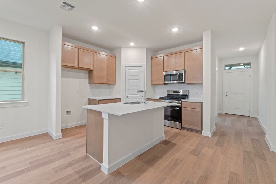 Kitchen in the Pearl home plan by Trophy Signature Homes – REPRESENTATIVE PHOTO Kitchen in the Pearl home plan by Trophy Signature Homes – REPRESENTATIVE PHOTO