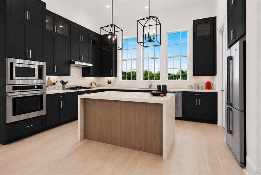 Gourmet kitchen featuring dark cabinetry, stainless steel appliances, a center island with a light-toned countertop, and multiple large windows