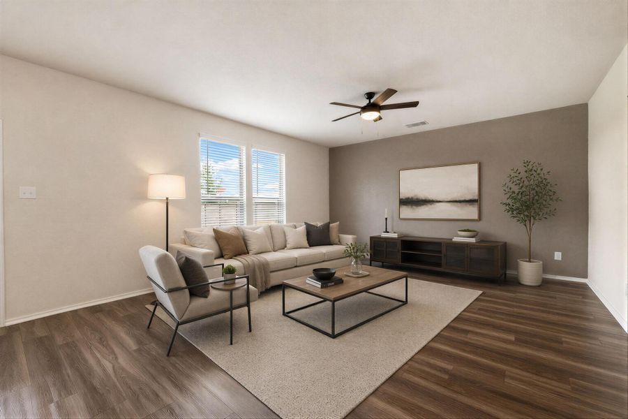 Hardwood-style flooring extends through this comfortable living space, centered by a modern ceiling fan. Virtually Staged Hardwood-style flooring extends through this comfortable living space, centered by a modern ceiling fan. Virtually Staged