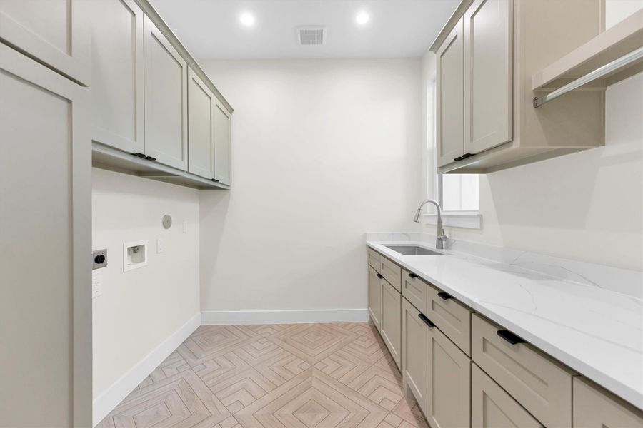 Stylish and functional laundry room with ample storage and a sleek, modern design.