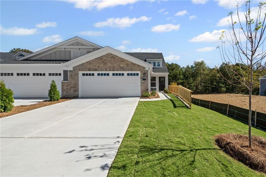 Front exterior of a new home in Villas at Gold Creek, Dawsonville, GA, highlighting curb appeal (Image 2). Front exterior of a new home in Villas at Gold Creek, Dawsonville, GA, highlighting curb appeal (Image 2).