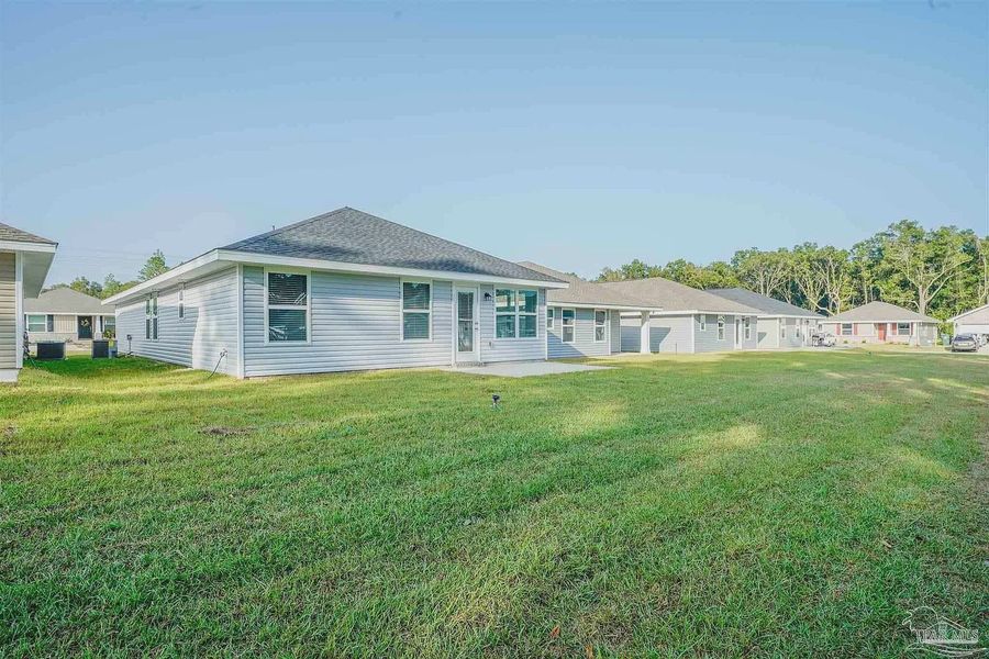 Exterior details and patio area of a home in Turtle Creek, Cantonment (Image 2).