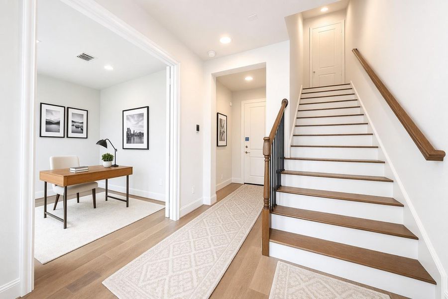 Bright first floor entryway and secondary bedroom (or office).  Virtual staging added.