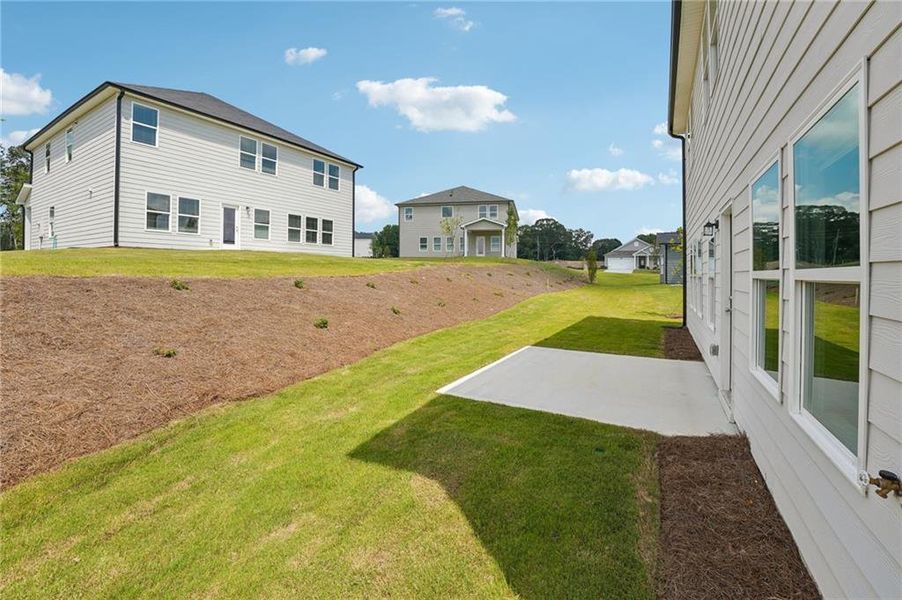 Exterior details and patio area of a home in Northwoods at Mirror Lake, Villa Rica (Image 4).
