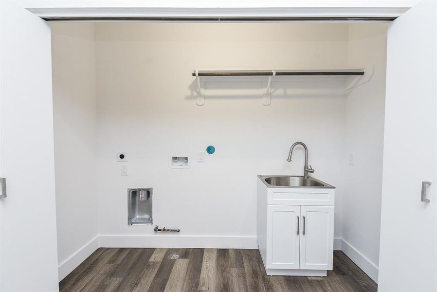 This is your huge utility closet, nicely accessorized with a welcomed sink and storage, above.