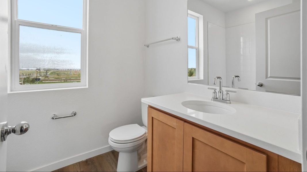 Secondary bathroom with vanity, window, and quality finishes. Secondary bathroom with vanity, window, and quality finishes.