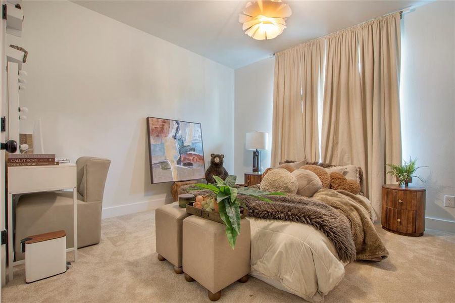 Carpeted bedroom with baseboards Carpeted bedroom with baseboards