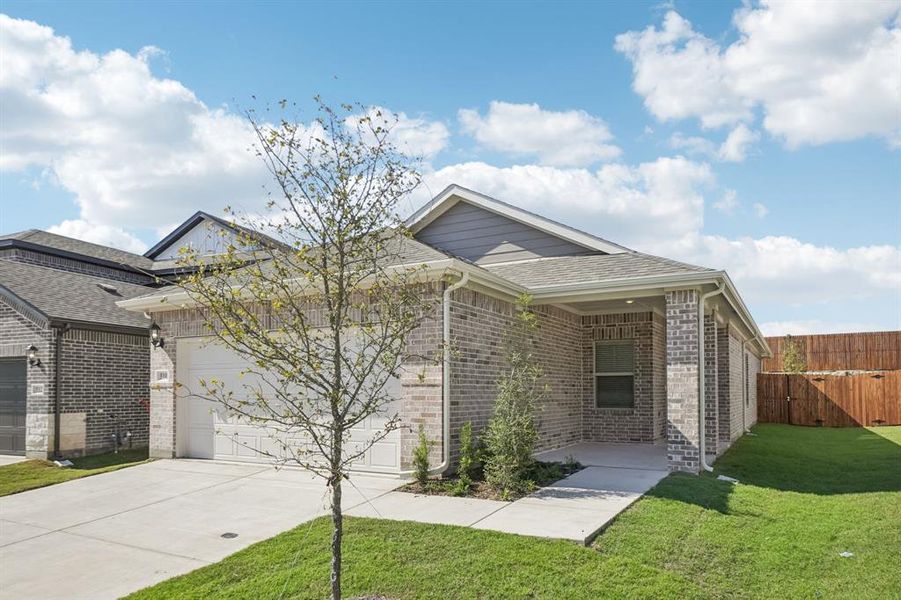 Front exterior of a new home in Eastridge - Spring Series, McKinney, TX, highlighting curb appeal (Image 20). Front exterior of a new home in Eastridge - Spring Series, McKinney, TX, highlighting curb appeal (Image 20).