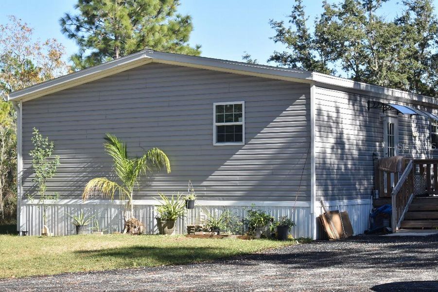 Exterior details and patio area of a home in , Williston (Image 28).