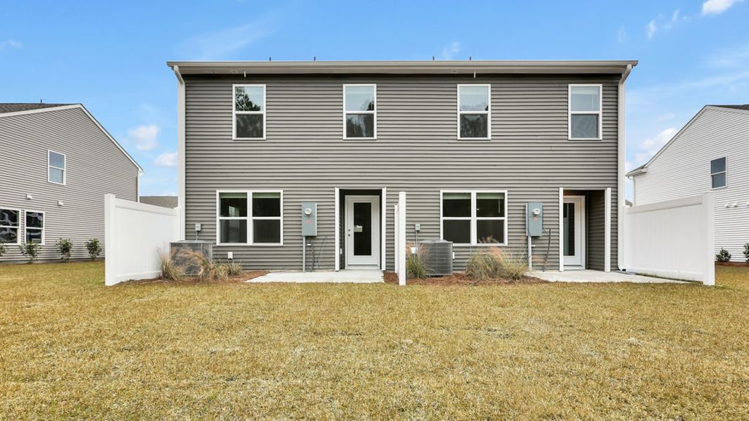 Exterior details and patio area of a home in Grayson Park Duets, Leland (Image 3).