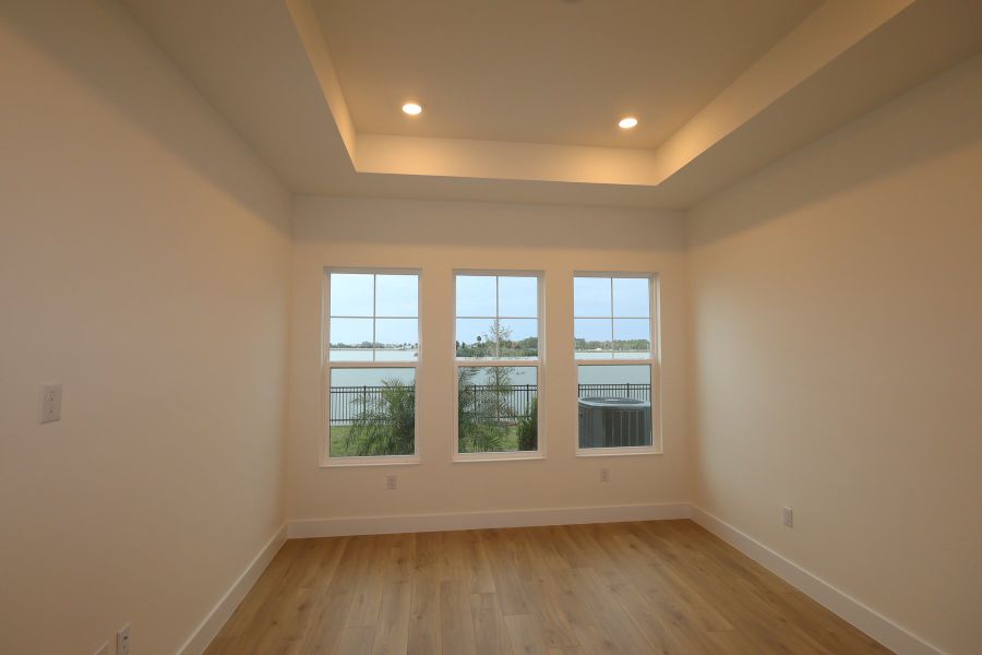 Spacious, unfurnished interior of a new home in Emerald Landing at Waterside at Lakewood Ranch – Lake Series, Sarasota (Image 7).