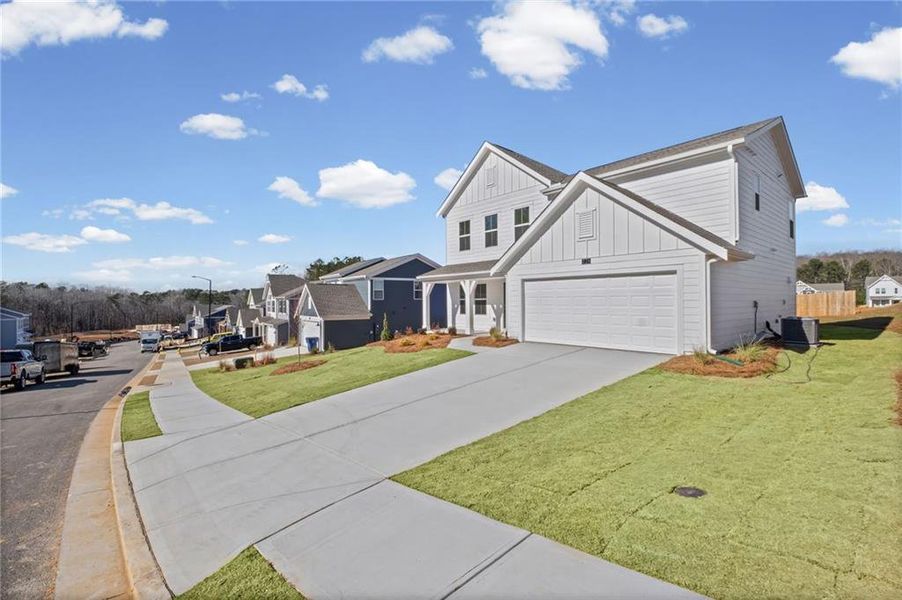 Front exterior of a new home in Sage Woods, Dallas, GA, highlighting curb appeal (Image 16).