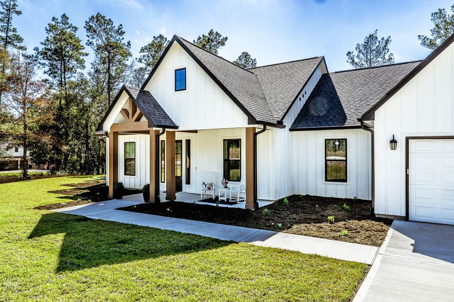 Covered Front Porch with beautiful wood accents