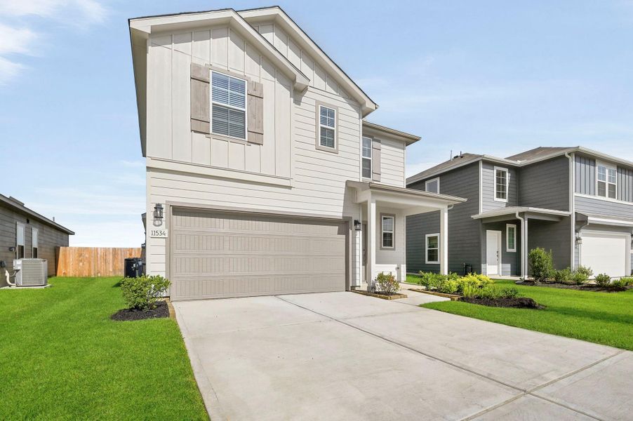 Front exterior of a new home in Barrett Crossing, Crosby, TX, highlighting curb appeal (Image 19).