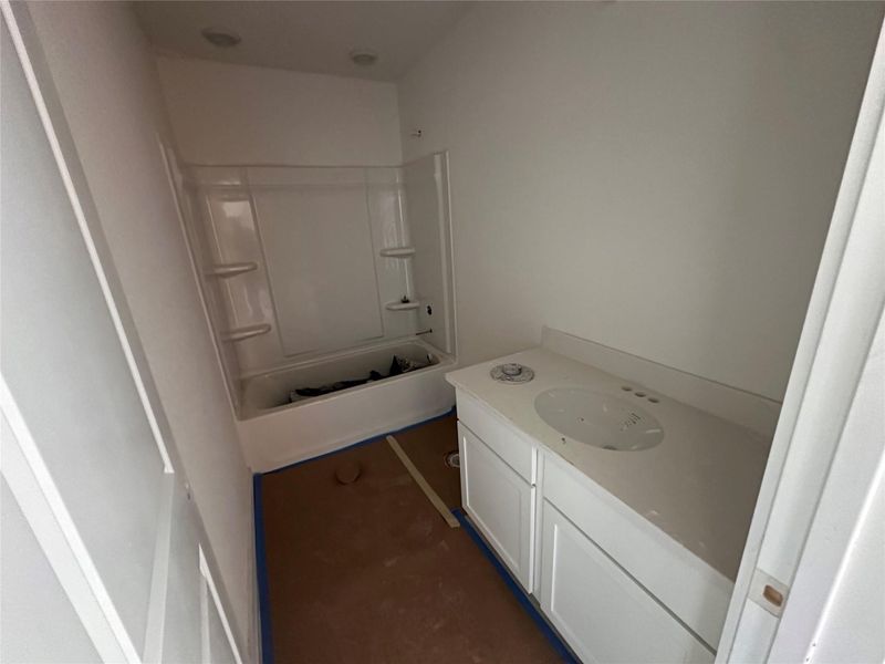 Bathroom featuring shower / washtub combination and vanity Bathroom featuring shower / washtub combination and vanity