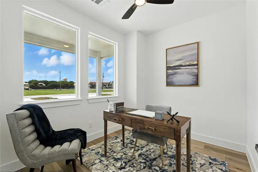 To the left of the entryway is a dedicated flex space with two large windows and a ceiling fan overhead! Perfect as a home office, guest space, playroom, you name it! To the left of the entryway is a dedicated flex space with two large windows and a ceiling fan overhead! Perfect as a home office, guest space, playroom, you name it!