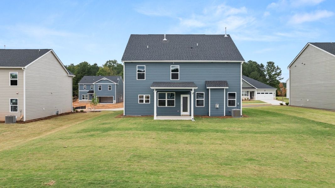 Exterior details and patio area of a home in Preserve at Dove Creek, Statham (Image 17).