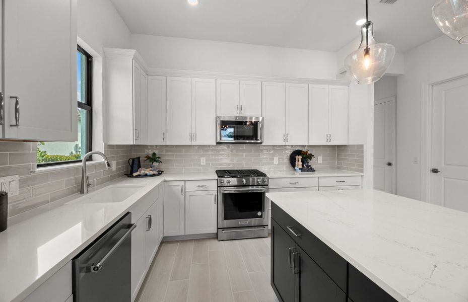 Representative furnished interior of a home built from the Prosperity by DiVosta in BeachWalk by Manasota Key, Englewood (Image 29).
