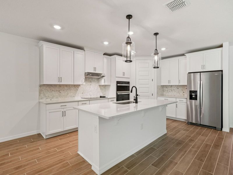 Furnished interior view inside a new home in Oakfield Trails - Signature Series, Parrish (Image 3). Furnished interior view inside a new home in Oakfield Trails - Signature Series, Parrish (Image 3).