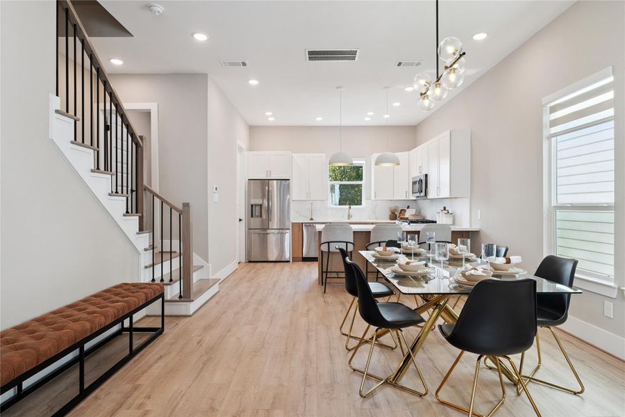 Spatial balance guides this dining zone—placed perfectly between culinary function and living flow.