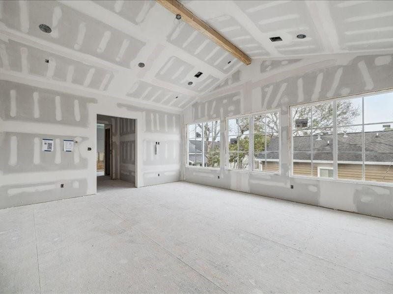 Primary Bedroom with vaulted ceiling