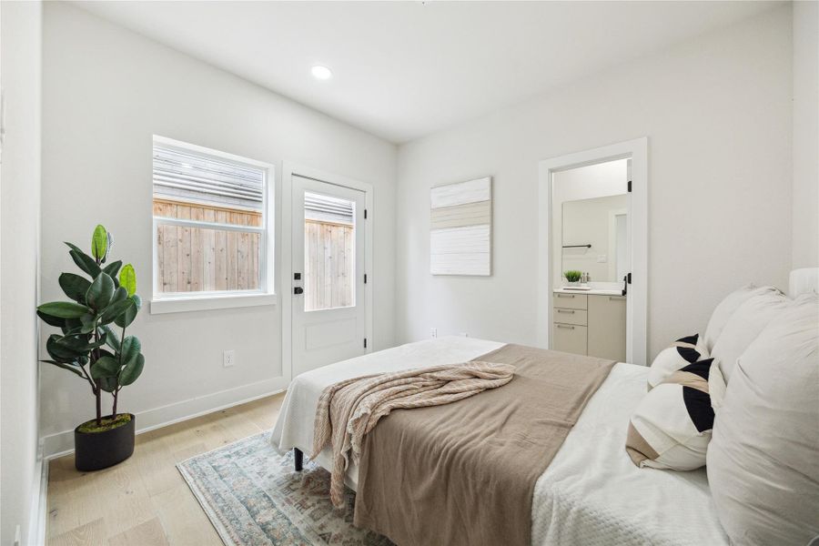 Cozy first-floor bedroom with ample natural light, private patio access, and en-suite convenience. Cozy first-floor bedroom with ample natural light, private patio access, and en-suite convenience.