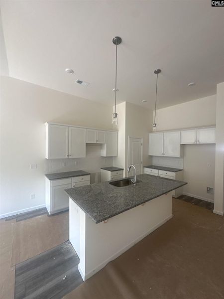 Furnished interior view inside a new home in Piney Woods Bluff, Columbia (Image 1). Furnished interior view inside a new home in Piney Woods Bluff, Columbia (Image 1).