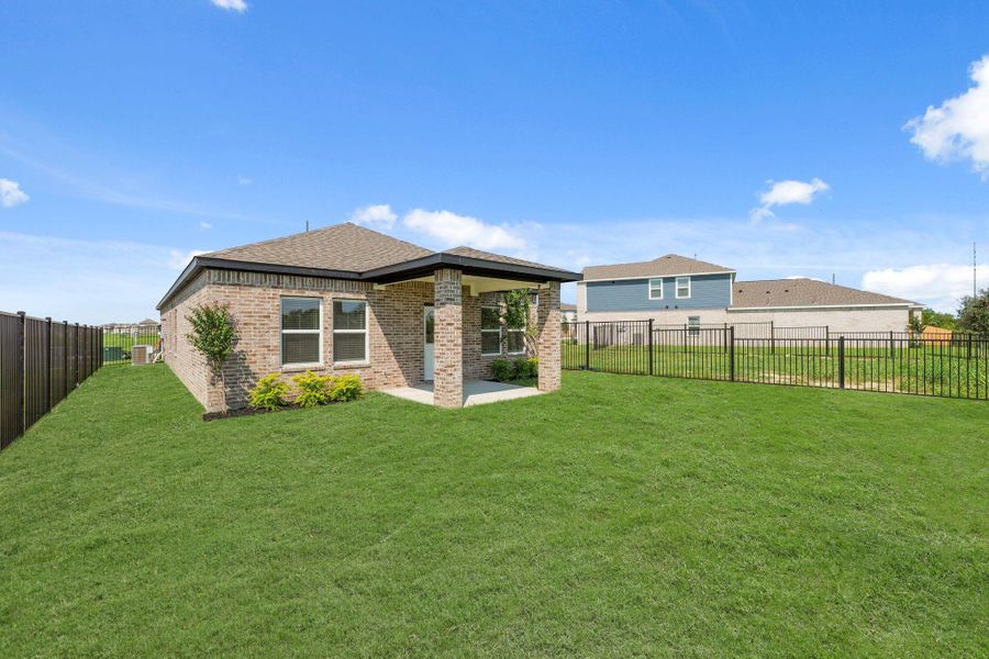 Exterior details and patio area of a home in River Ranch Trails, Dayton (Image 20).