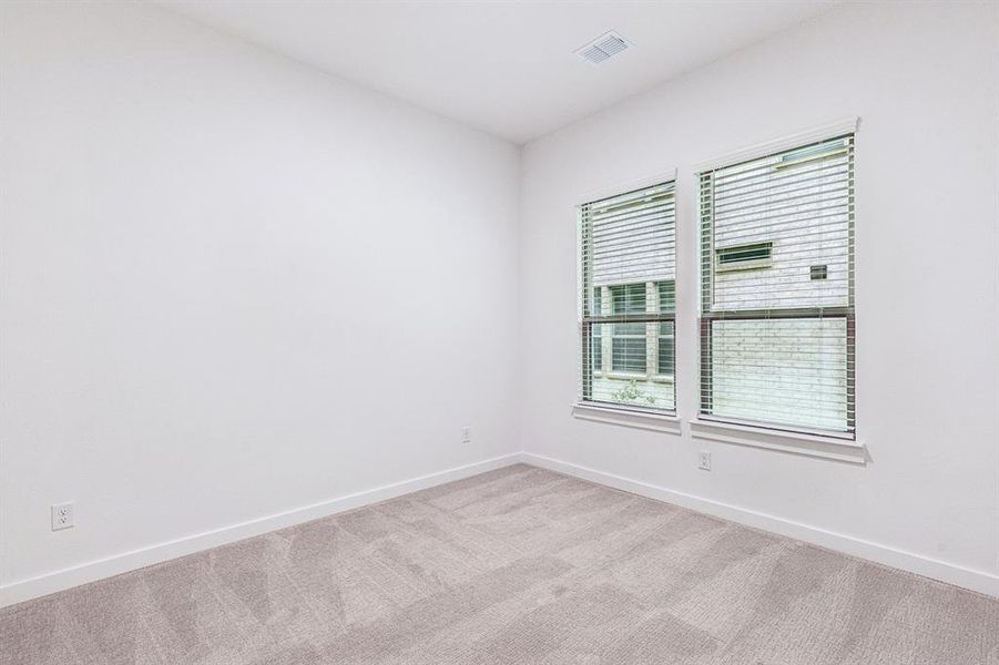 Bedroom in the Picasso II home plan by Trophy Signature Homes – REPRESENTATIVE PHOTO