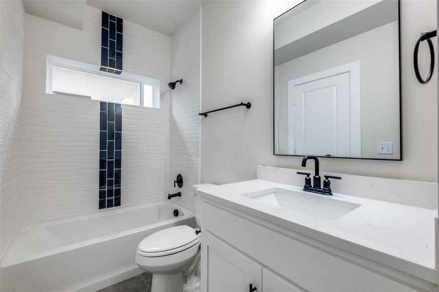 Bathroom with vanity and washtub / shower combination Bathroom with vanity and washtub / shower combination